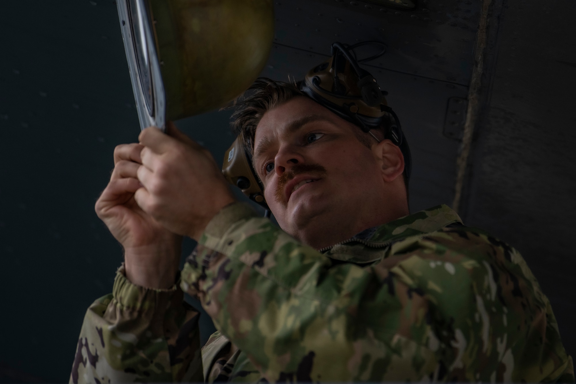 U.S. Air Force Master Sgt. Michael Hurst, 317th Aircraft Maintenance Squadron production superintendent, inspects a panel on a C-130J Super Hercules at Pope Army Airfield, North Carolina, Jan. 25, 2023. During Battalion Mass Tactical Week, Hurst ensured that maintenance performed on the C-130s was completed correctly ensuring that the aircrew and aircraft are safe during flight. (U.S. Air Force photo by Airman 1st Class Ryan Hayman)