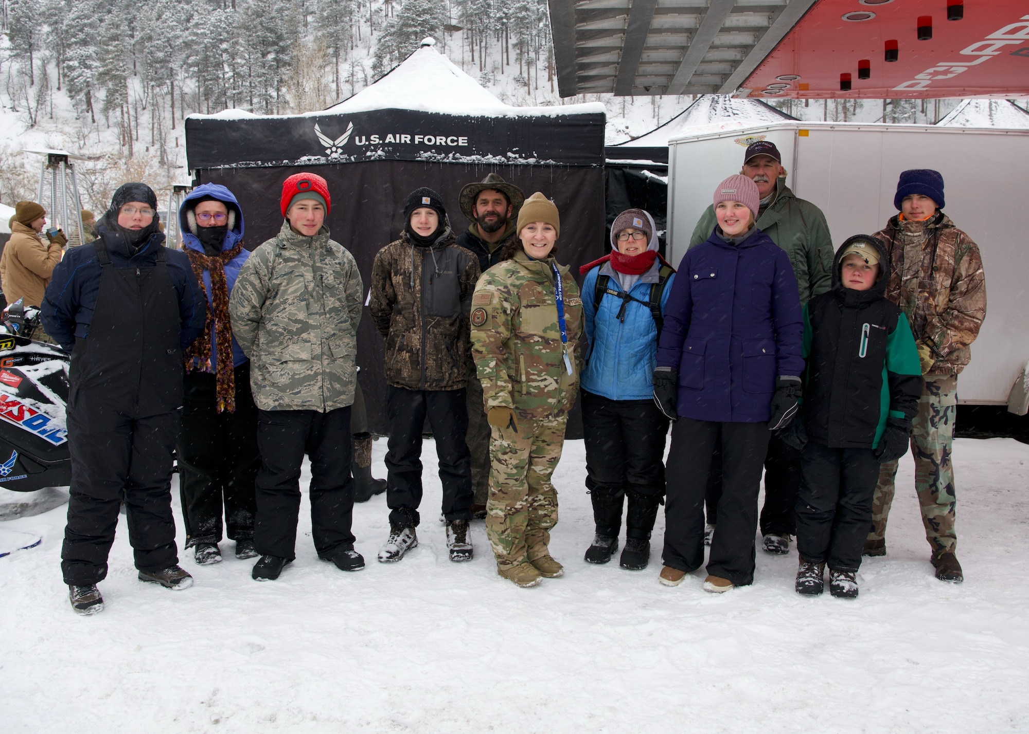 Brig. Gen. Lisa Craig stands with Civil Air Patrol Cadets and their parents