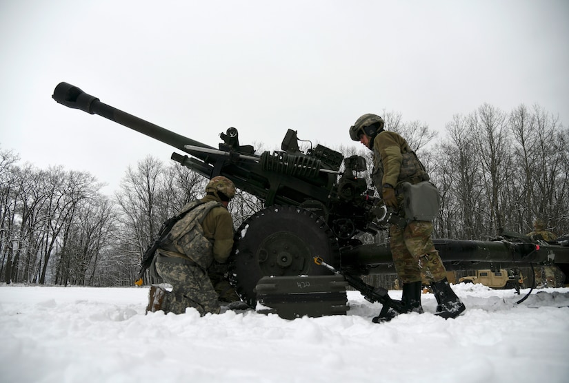 A gun team from the Wisconsin Army National Guard’s 1st Battalion, 120th Field Artillery Regiment, set up an M119 howitzer during Northern Strike 23-1 on Jan. 21, 2023, at Camp Grayling, Mich. The 120th Field Artillery is building readiness by conducting cold-weather training to meet objectives of the Department of Defense’s Arctic strategy.