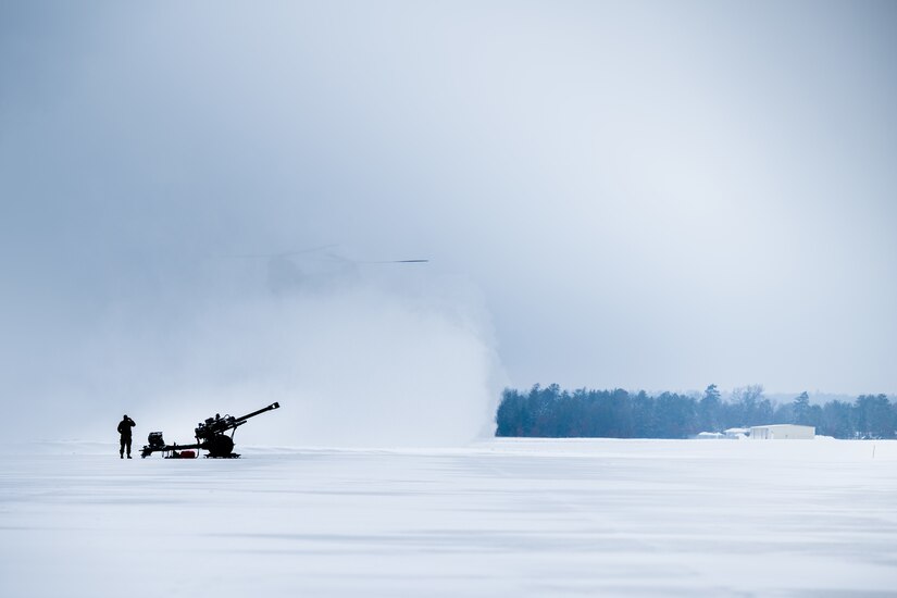 A Soldier from the Wisconsin Army National Guard’s 1st Battalion, 120th Field Artillery Regiment, watches as a CH-47 Chinook assigned to the Michigan Army National Guard’s Detachment 1, Bravo Company 3-328th Aviation Regiment, lands during Northern Strike 23-1, Jan. 24, 2023, at Grayling Army Airfield, Mich. Units that participate in Northern Strike’s winter iteration build readiness by conducting joint, cold-weather training to meet objectives of the Department of Defense’s Arctic strategy.