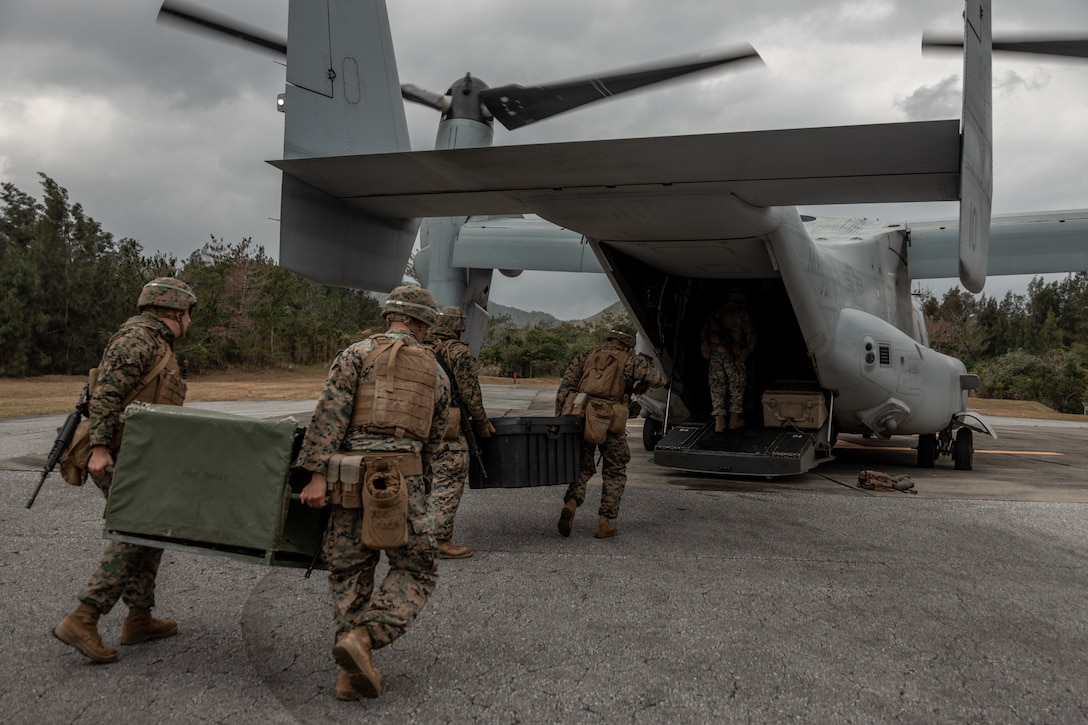 U.S. Marines with Combat Logistics Regiment 3 (CLR-3) load a 3,000 gallon collapsible fuel tank and Lightweight Water Purification System (LWPS) onto an MV-22B Osprey with Marine Medium Tiltrotor Squadron 265 during a field training exercise at Landing Zone Swallow, Jan. 24, 2023. The purpose of the exercise was to simulate real-world scenarios in a contested environment as well as train in experimental embarkation operations as proof of concept for Force Design 2030. (U.S. Marine Corps photo by Lance Cpl. Sydni Jessee)