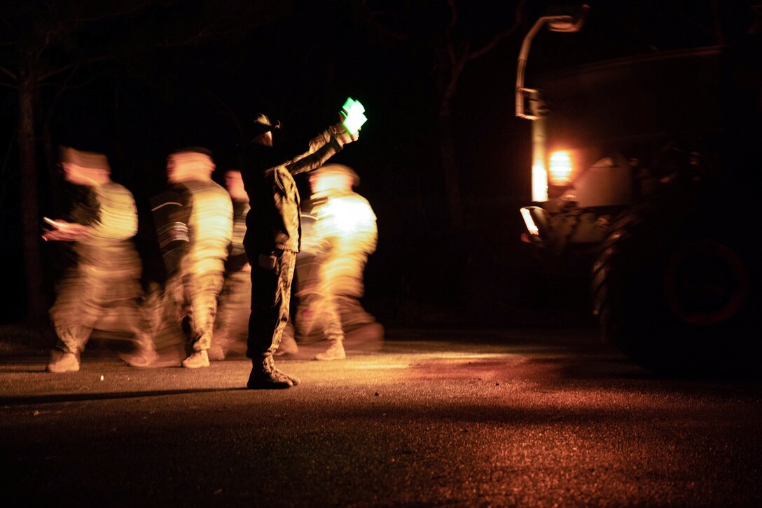 U.S. Marine Corps Cpl. Austin Spitzer, a motor transport operator with Combat Logistics Regiment 37 (CLR-37), guides a medium tactical vehicle replacement at the Central Training Area, Camp Hansen, Okinawa, Japan, Jan. 25, 2023. 3rd MLG, based out of Okinawa, Japan, is a forward-deployed combat unit that serves as III Marine Expeditionary Force’s comprehensive logistics and combat service support backbone for operations throughout the Indo-Pacific area of responsibility. (U.S. Marine Corps photo by Lance Cpl. Sebastian Riveraaponte)