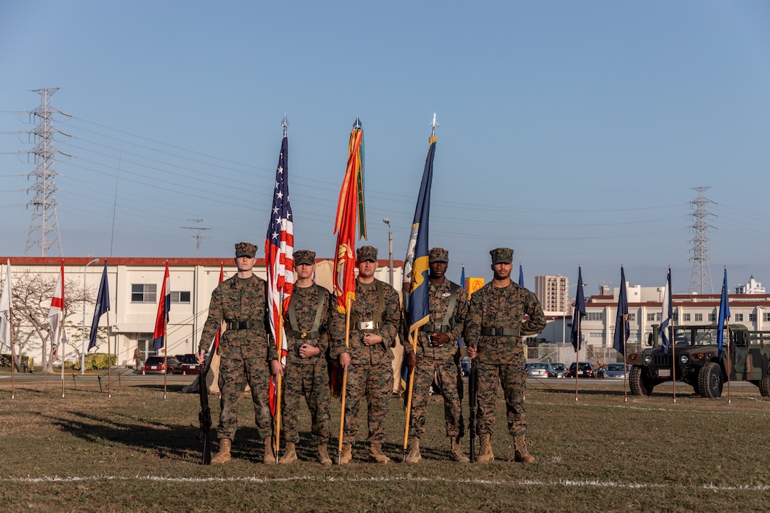 U.S. Marines and a Sailor with the 3rd Marine Logistics Group (MLG) color guard stand at parade rest during a change of command ceremony at Camp Foster, Okinawa, Japan, Jan. 31, 2023. During the ceremony, Capt. Darryl Arfsten, the outgoing commanding officer, relinquished command of 3rd Medical Battalion to Capt. Justin C. Logan, the oncoming commanding officer. 3rd MLG, based out of Okinawa, Japan, is a forward-deployed combat unit that serves as III Marine Expeditionary Force’s comprehensive logistics and combat service support backbone for operations throughout the Indo-Pacific area of responsibility. (U.S. Marine Corps photo by Lance Cpl. Sydni Jessee)