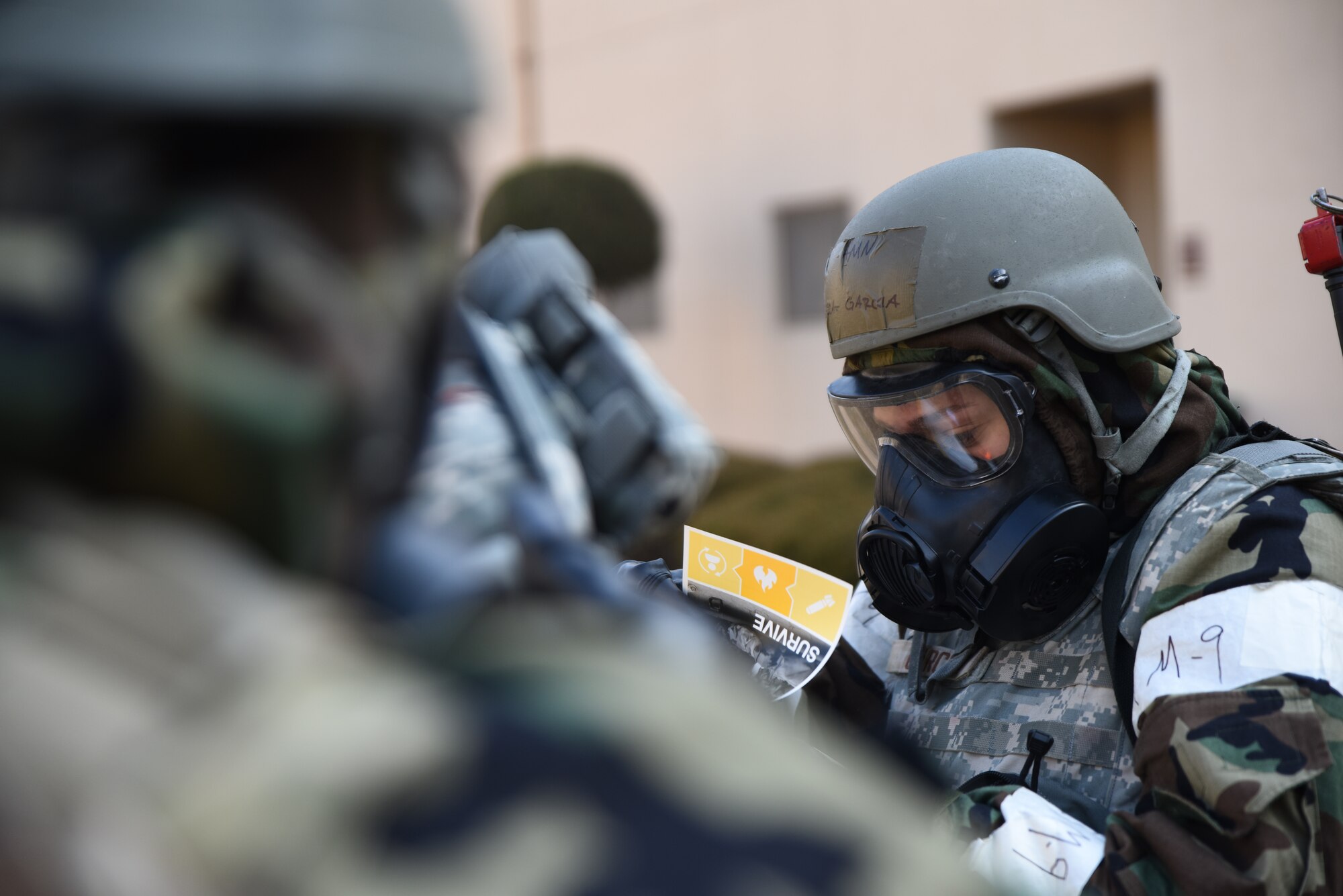 Airman Isabella Garcia, 51st Force Support Squadron food service apprentice, reviews her Airman’s Manual during a base-wide training event at Osan Air Base, Republic of Korea, Feb. 1, 2023. The Airman’s Manual is a quick-reference guide to assist Airmen in contingency operations. (U.S. Air Force photo by 1st Lt Michelle Chang)