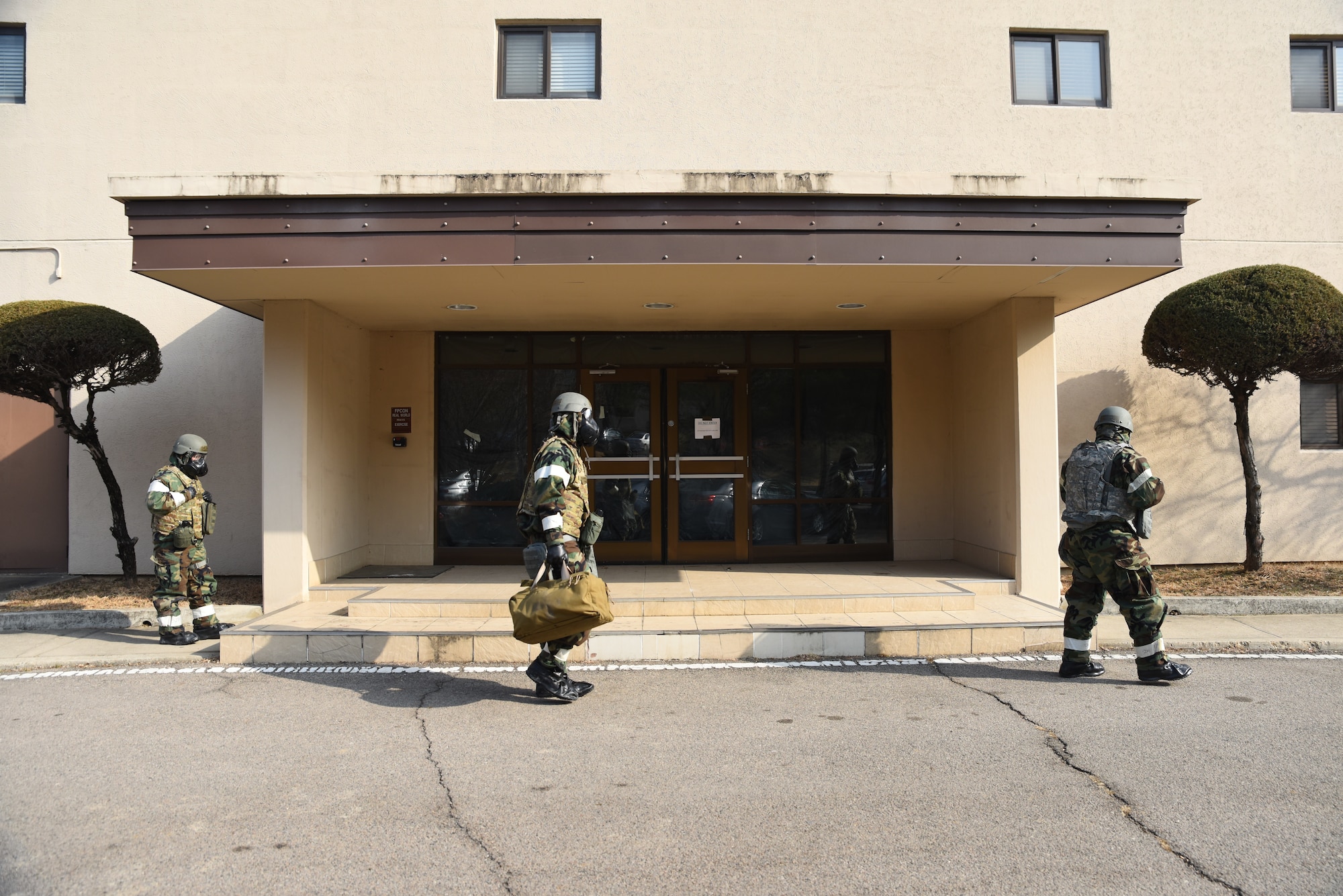 U.S. Air Force Airmen from the 51st Comptroller Squadron conduct a post-attack reconnaissance (PAR) sweep during a training event at Osan Air Base, Republic of Korea, Feb. 1, 2023. PAR sweeps are conducted following an attack to check for any possible hazards within a perimeter surrounding structures. (U.S. Air Force photo by 1st Lt Michelle Chang)