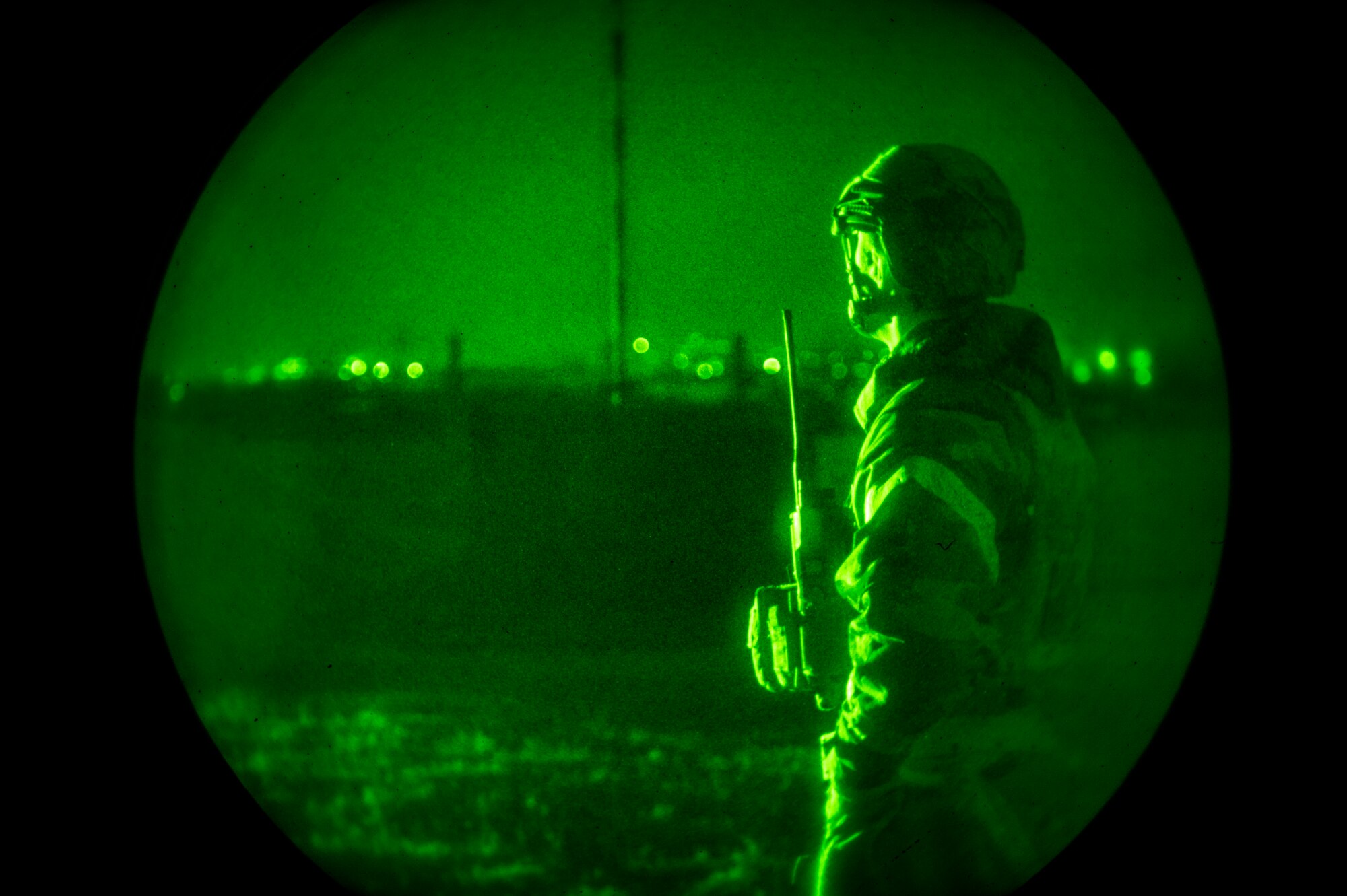 U.S. Air Force Tech Sgt. Tyler Hopkins, 51st Security Forces Squadron Wing Inspection Team member, observes Airmen during a night-time defend-the-base training scenario at Osan Air Base, Republic of Korea, Jan. 31 2023. Osan’s WIT ensures Airmen are mission capable by finding deficiencies during training events and making any corrections needed for future readiness. (U.S. Air Force photo by Airman 1st Class Aaron Edwards)