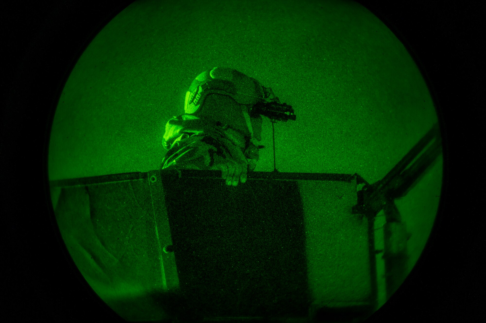 U.S. Air Force Airman 1st Class Will Dorvilier, 51st Security Forces Squadron Defender, scans for simulated opposing forces during a night-time defend-the-base training scenario at Osan Air Base, Republic of Korea, Jan. 31 2023. As a Humvee gunner, Dorvilier is responsible for providing the first line of defense for the vehicle and his team through surveillance, target acquisition, and engagement of opposing forces with lethal force. (U.S. Air Force photo by Airman 1st Class Aaron Edwards)