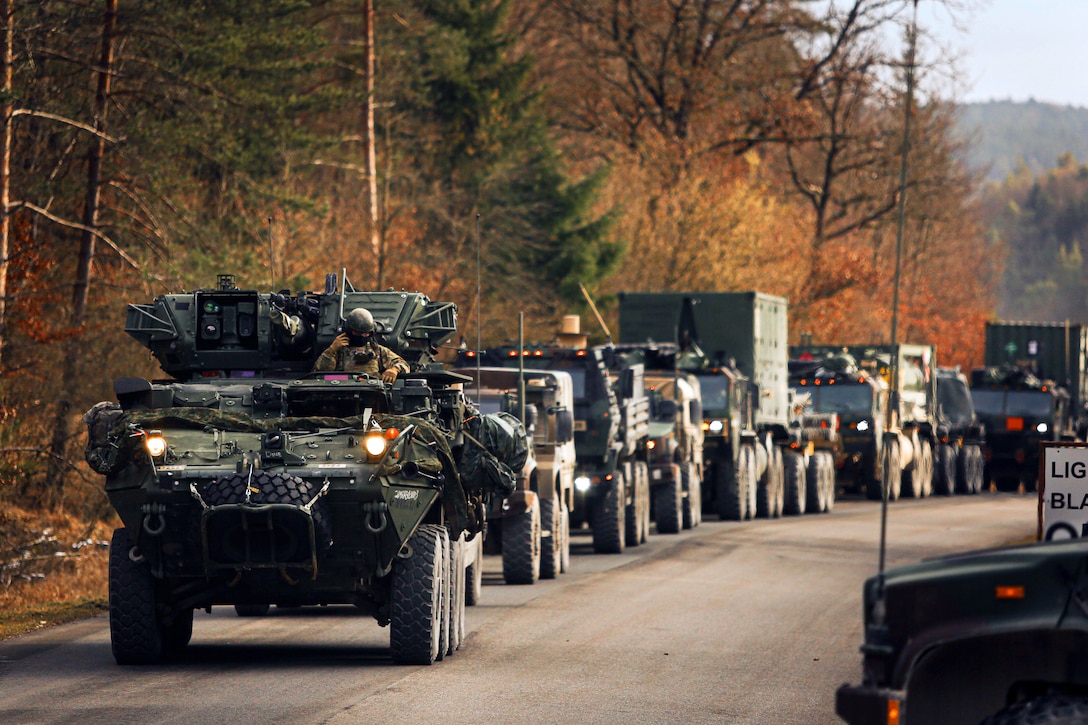 Soldiers conduct a convoy during an exercise.