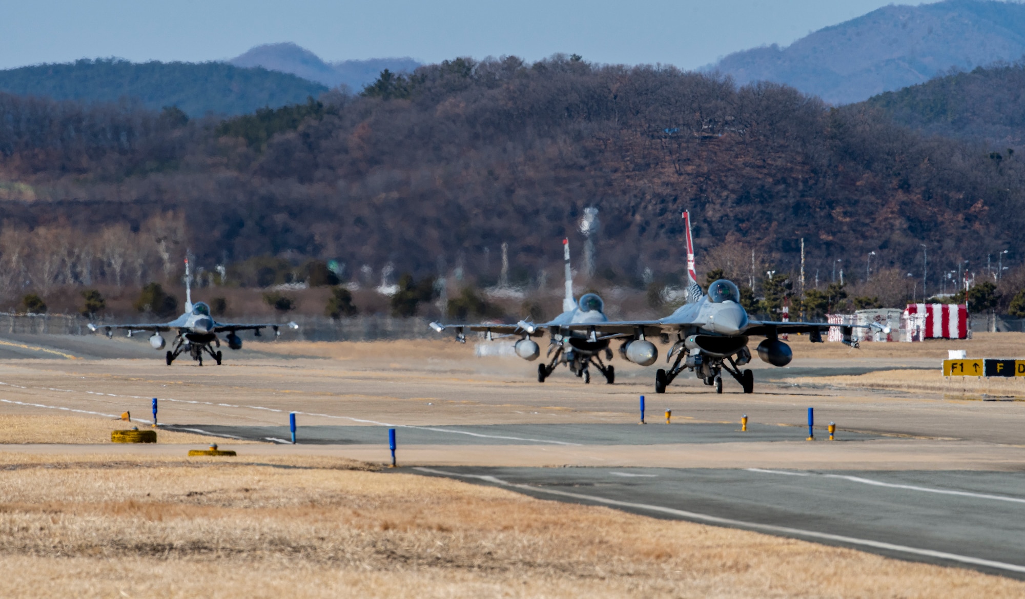 Three U.S. Air Force F-16 Fighting Falcons, 36th Fighter Squadron, taxi on the runway after landing during a training event at Daegu Air Base, Republic of Korea, Jan. 30, 2023.