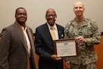 Naval Surface Warfare Center, Philadelphia Division Commanding Officer Capt. Dana Simon and Technical Director Nigel C. Thijs present retired U.S. Marine Corps Major General, the Honorable Dr. Clifford L. Stanley with a certificate of appreciation during the Naval Sea Systems Command Joint Warfare Centers’ Martin Luther King Jr. Day Observance hosted by NSWCPD on Jan. 19, 2023.  (U.S. Navy photo by Gary Ell, Ctr/Released)