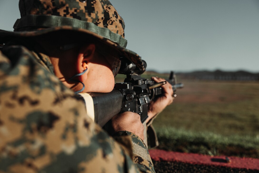 A U.S. Marine Corps recruit with Hotel Company, 2nd Recruit Training Battalion, fires his rifle during a table one course of fire at Marine Corps Base Camp Pendleton, California, Jan. 31, 2023. The table one course of fire covered the basic fundamentals of marksmanship and rifle safety. (Marine Corps photo by Lance Cpl. Devereux)