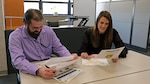 Michael Hughes, management analyst, J-3, and Karlie Shrewsbury, management analyst, J-3, discuss topics to be covered during their next “30 Minute Thursdays” forum. The recurring forum is held every Thursday at noon CDT and calls for open discussion in the agile recruiting environment.