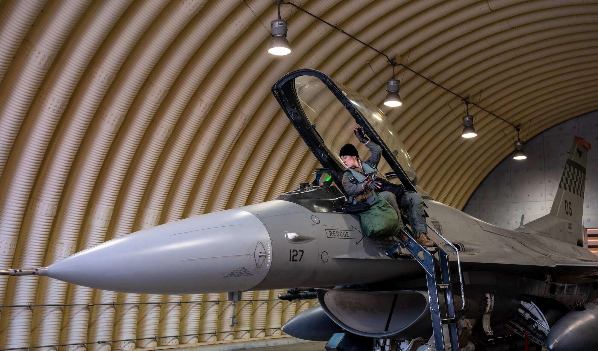 U.S. Air Force 1st Lt. Demi Yurcisin, 36th Fighter Squadron pilot, climbs into an F-16 Fighting Falcon during a routine training event at Daegu Air Base, Republic of Korea, Jan. 31, 2023.