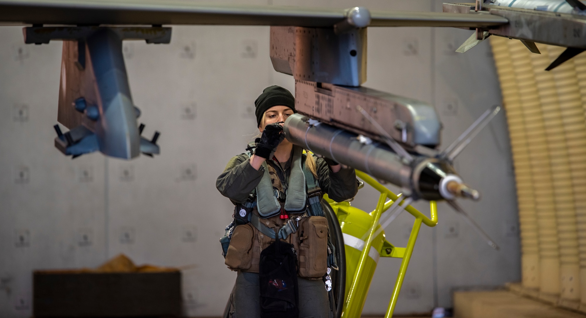 U.S. Air Force 1st Lt. Demi Yurcisin, 36th Fighter Squadron pilot, performs pre-flight checks on an F-16 Fighting Falcon during a routine training event at Daegu Air Base, Republic of Korea, Jan. 31, 2023.