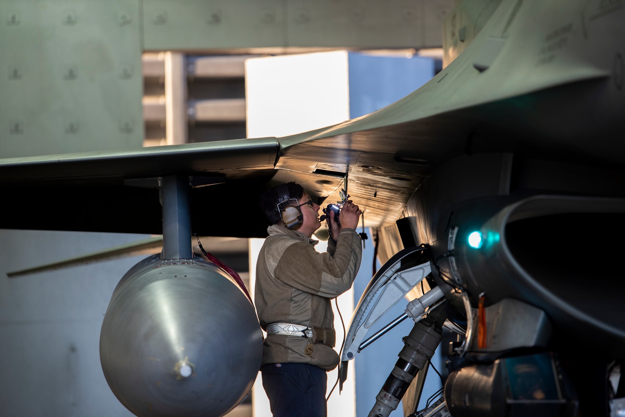 U.S. Air Force Senior Airman Henry Morocho, 36th Fighter Generation Squadron aircraft propulsion technician, performs pre-flight checks on an F-16 Fighting Falcon during a routine training event at Daegu Air Base, Republic of Korea, Jan. 31, 2023.