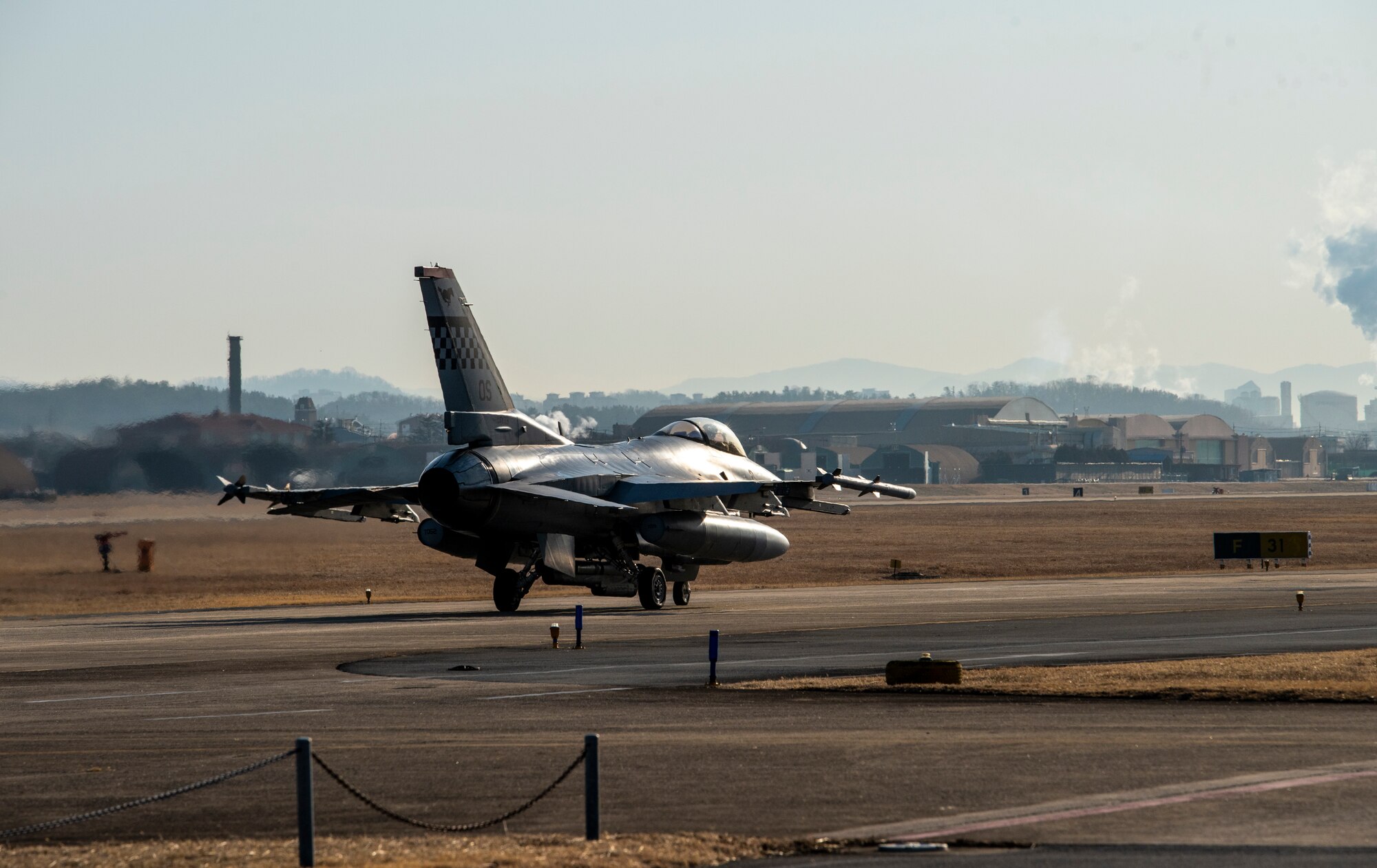 A U.S. Air Force F-16 Fighting Falcon, 36th Fighter Squadron, taxis on the runway before flight during a training event at Daegu Air Base, Republic of Korea, Jan. 31, 2023.