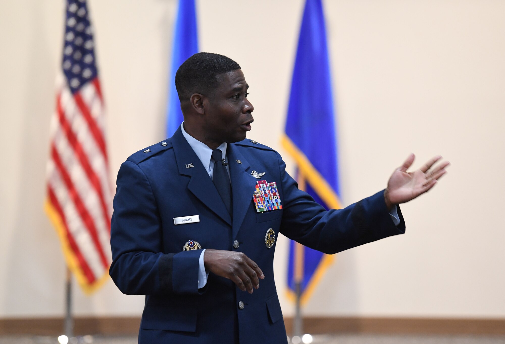 U.S. Air Force Brig. Gen. Terrence Adams, Director, Cyberspace Operations and Warfighter Communications, Office of the Deputy Chief of Staff for Intelligence, Surveillance, Reconnaissance, and Cyber Effects Operations, Headquarters Pentagon, delivers remarks during the annual Dr. Martin Luther King Jr. Luncheon inside the Roberts Consolidated Aircraft Maintenance Facility at Keesler Air Force Base, Mississippi, Jan. 30, 2023.