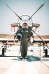 Michael Deigh poses in front of a T-6 Texan II trainer aircraft as part of the 560th Flying Training Squadron’s “Pilot for a Day” program, Jan. 13, 2023, at Joint Base San Antonio-Randolph, Texas.