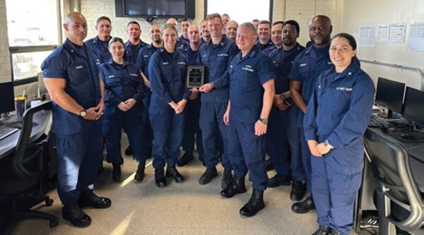 Vice Adm. Paul F. Thomas, Coast Guard deputy commandant for mission support (center), presents the 2021 Excellence in Customer Service Award for small units to ISVS PRO Baltimore staff in November 2022. U.S. Coast Guard photo.