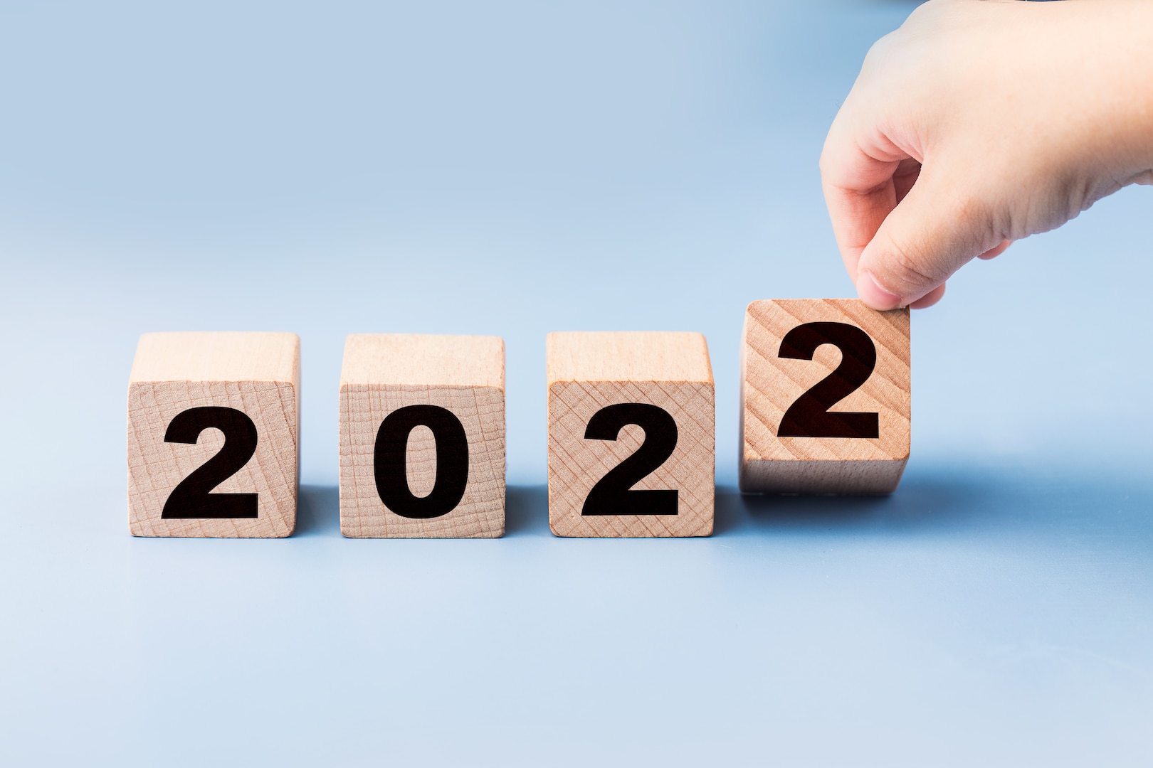 Four wooden blocks that have 2022 numbers