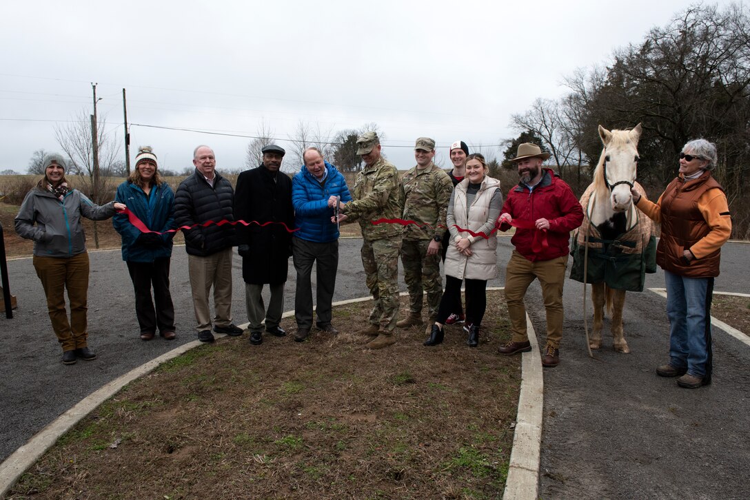 Government officials, stakeholders and citizens cut a ribbon to dedicate the completion of the North Murfreesboro Greenway Project Jan. 31, 2023, at the Walter Hill Trailhead in Murfreesboro, Tennessee. The event recognized the completion of work by the U.S. Army Corps of Engineers Nashville District on two additional miles of paved pedestrian trails and improvements to the popular 18-mile Twin Forks Equestrian Trail. (USACE Photo by Lee Roberts)