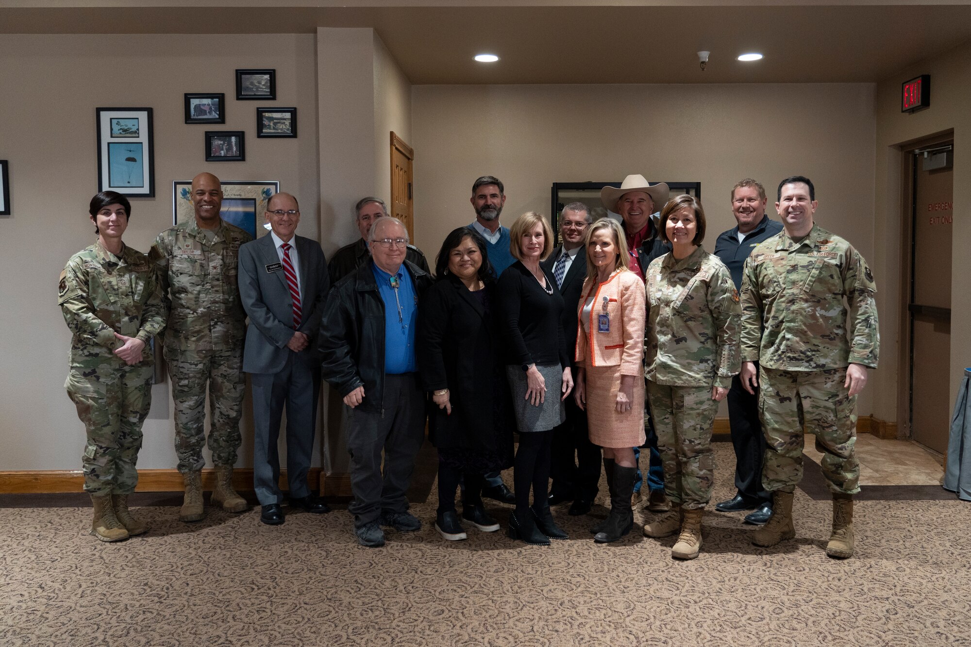 U.S. Air Force members and Civilians pose for a photo.