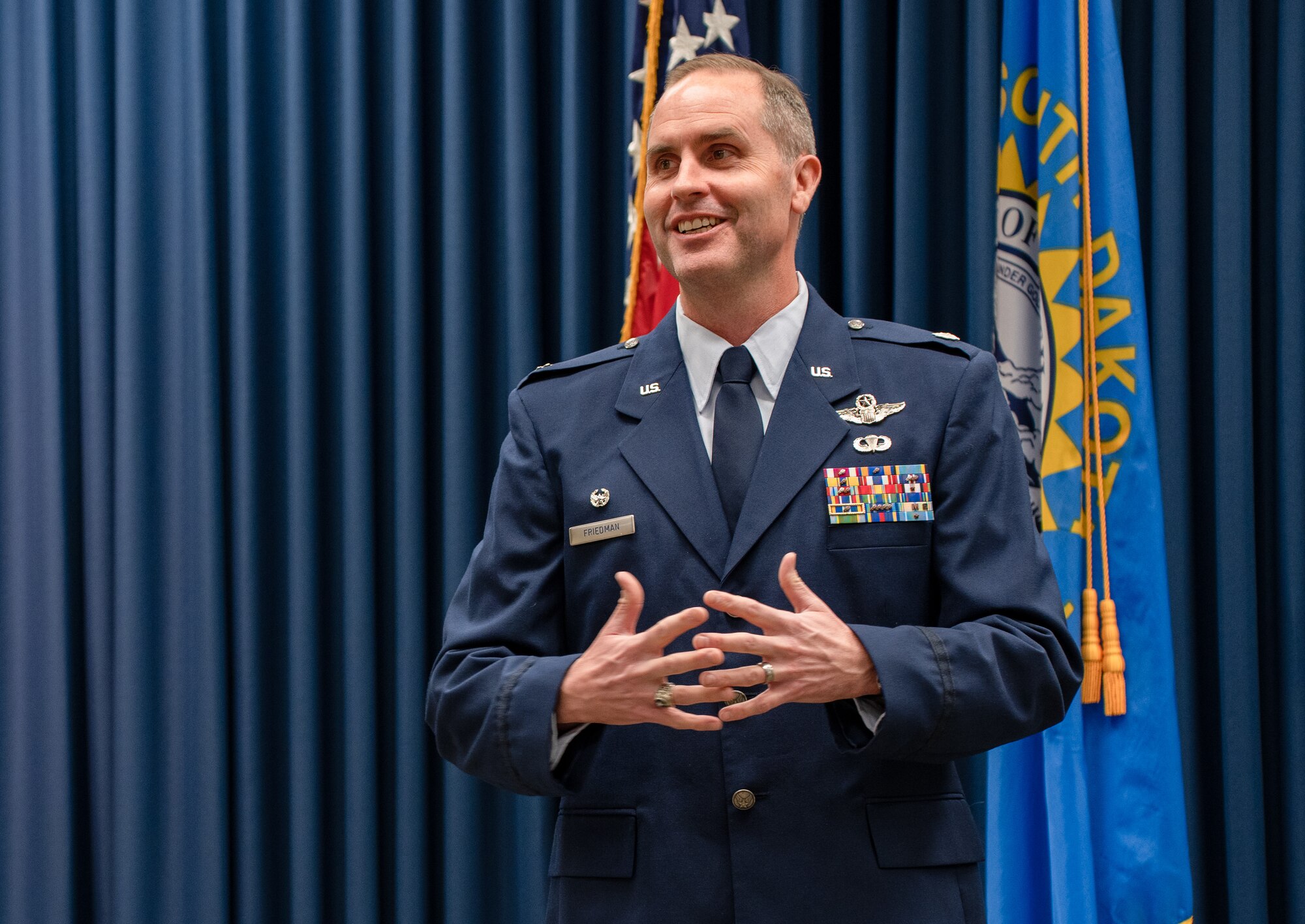U.S. Air National Guard Lt. Col. Jon Friedman, 114th Operations Group Commander, speaks during a Change of Command ceremony
