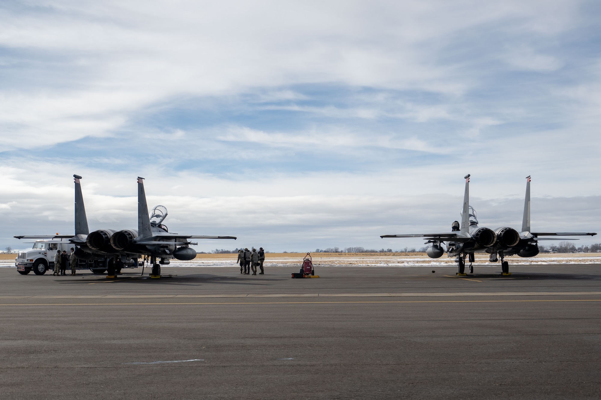 Photo of Airmen inspecting aircraft