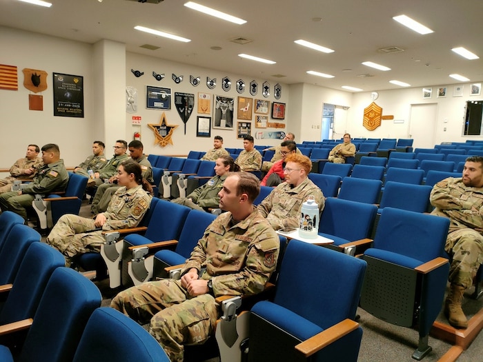 students sitting in an audience