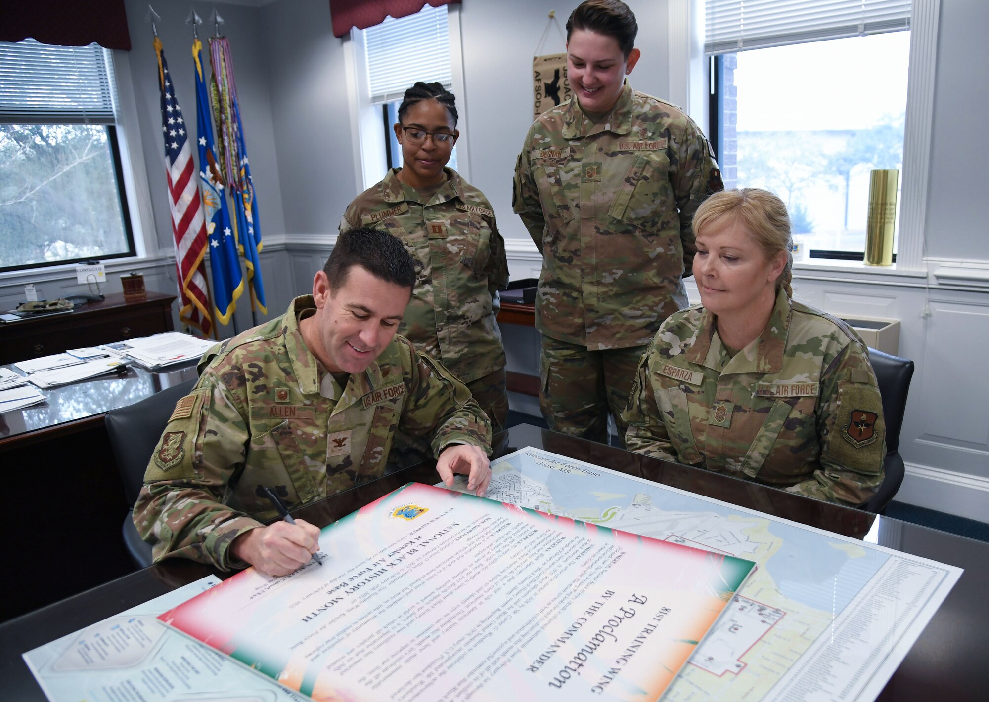 U.S. Air Force Col. Jason Allen, 81st Training Wing commander, signs the National Black History Month proclamation inside the 81st TRW headquarters building at Keesler Air Force Base, Mississippi, Jan. 2, 2023.