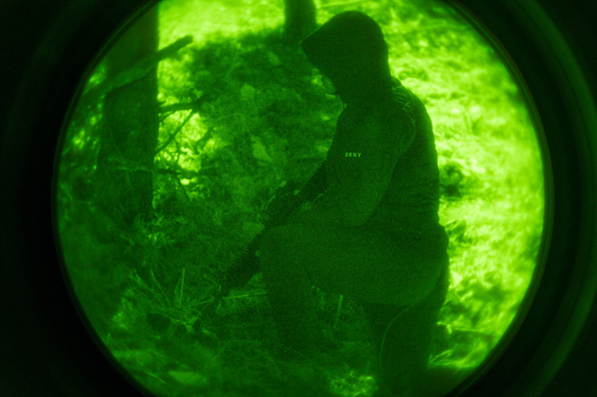 U.S. Air Force Senior Airman Luis Huitron, 51st Security Forces Squadron Defender, plays the role of opposing forces (OPFOR) during a night-time base defense training scenario at Osan Air Base, Republic of Korea, Feb. 1, 2023. OPFOR members simulate enemy movements and attacks providing a realistic threat environment for 51st SFS Defenders to train in. (U.S. Air Force photo by Airman 1st Class Aaron Edwards)