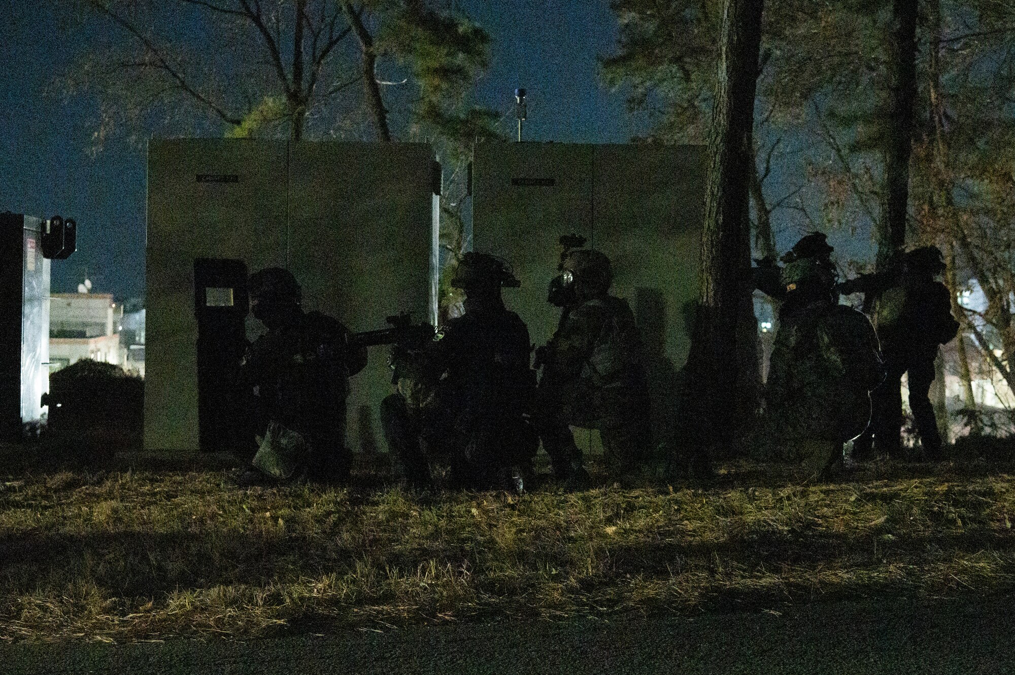 Republic of Korea Military Police and a U.S. Air Force 51st Security Forces Squadron Defender prepare to engage simulated opposing forces during a night-time base defense training scenario at Osan Air Base, Republic of Korea, Jan. 31, 2023. The training was used as an opportunity for security forces and ROKMPs to jointly practice base defense tactics in the event of a hostile invasion. (U.S. Air Force photo by Airman 1st Class Aaron Edwards)