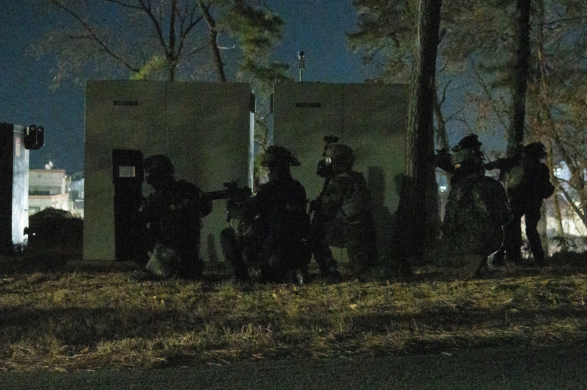 Republic of Korea Military Police and a U.S. Air Force 51st Security Forces Squadron Defender prepare to engage simulated opposing forces during a night-time base defense training scenario at Osan Air Base, Republic of Korea, Jan. 31, 2023. The training was used as an opportunity for security forces and ROKMPs to jointly practice base defense tactics in the event of a hostile invasion. (U.S. Air Force photo by Airman 1st Class Aaron Edwards)