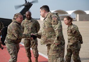 Maj. Gen. Linda S. Hurry (left), director of logistics, deputy chief of staff for logistics, engineering and force protection, Headquarters Air Force, shakes hands with Maj. Jason Bramlett, 35th Fighter Generation Squadron commander, at Kunsan Air Base, Republic of Korea, Feb. 1, 2023. During her visit, Hurry met with several leaders who oversee Kunsan’s logistical operations to learn about their needs. (U.S. Air Force photo by Staff Sgt. Sadie Colbert)