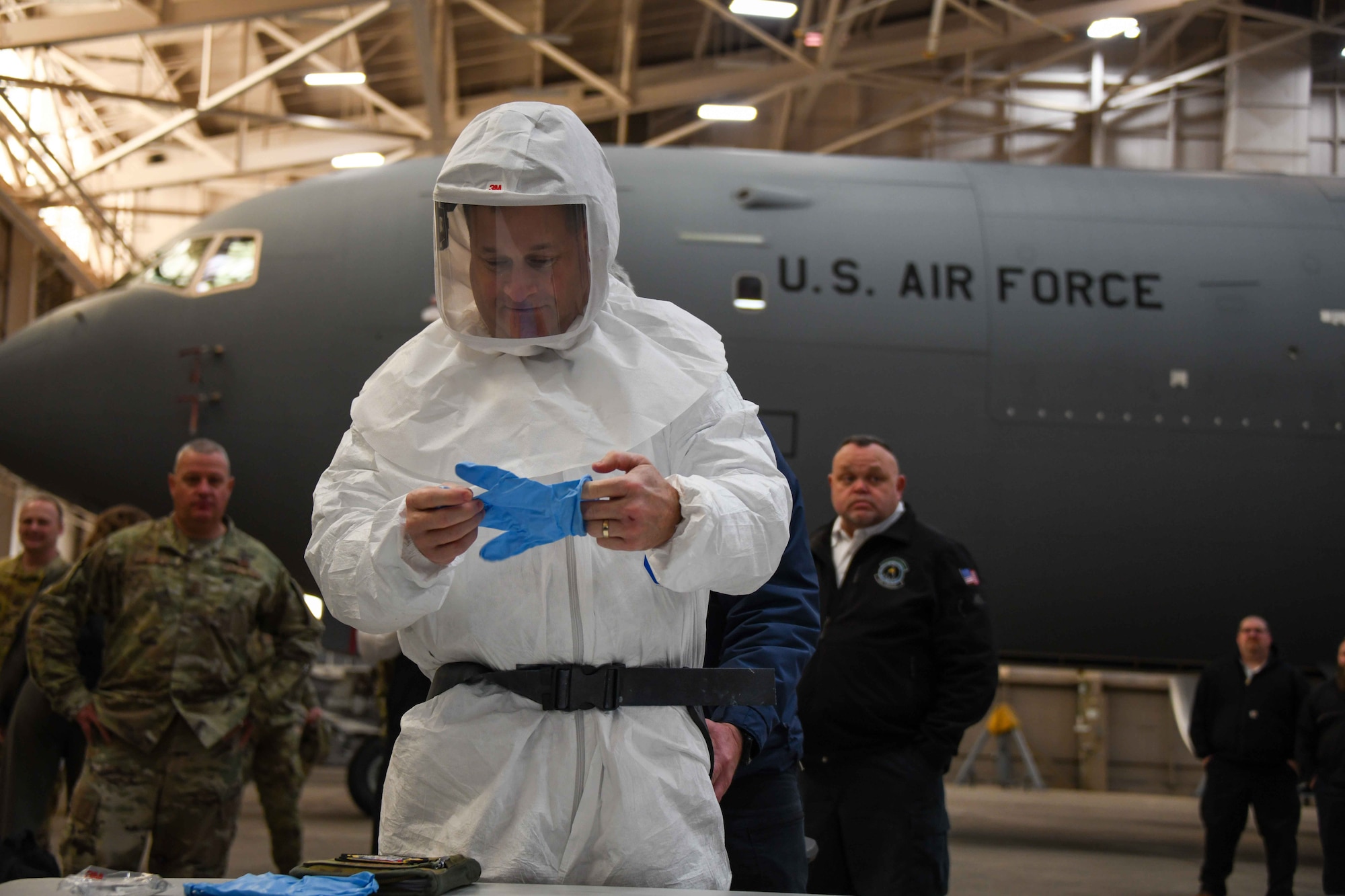 U.S. Air Force Maj. Gen. Phillip Stewart, 19th Air Force commander, suits up to get in the “blast booth” in Hangar 285 at Altus Air Force Base, Oklahoma, Jan. 26, 2023. The booth was created and is utilized by 97th Maintenance Squadron maintainers to help maintain KC-46 Pegasus’ wheels. (U.S. Air Force photo by Airman 1st Class Kari Degraffenreed)