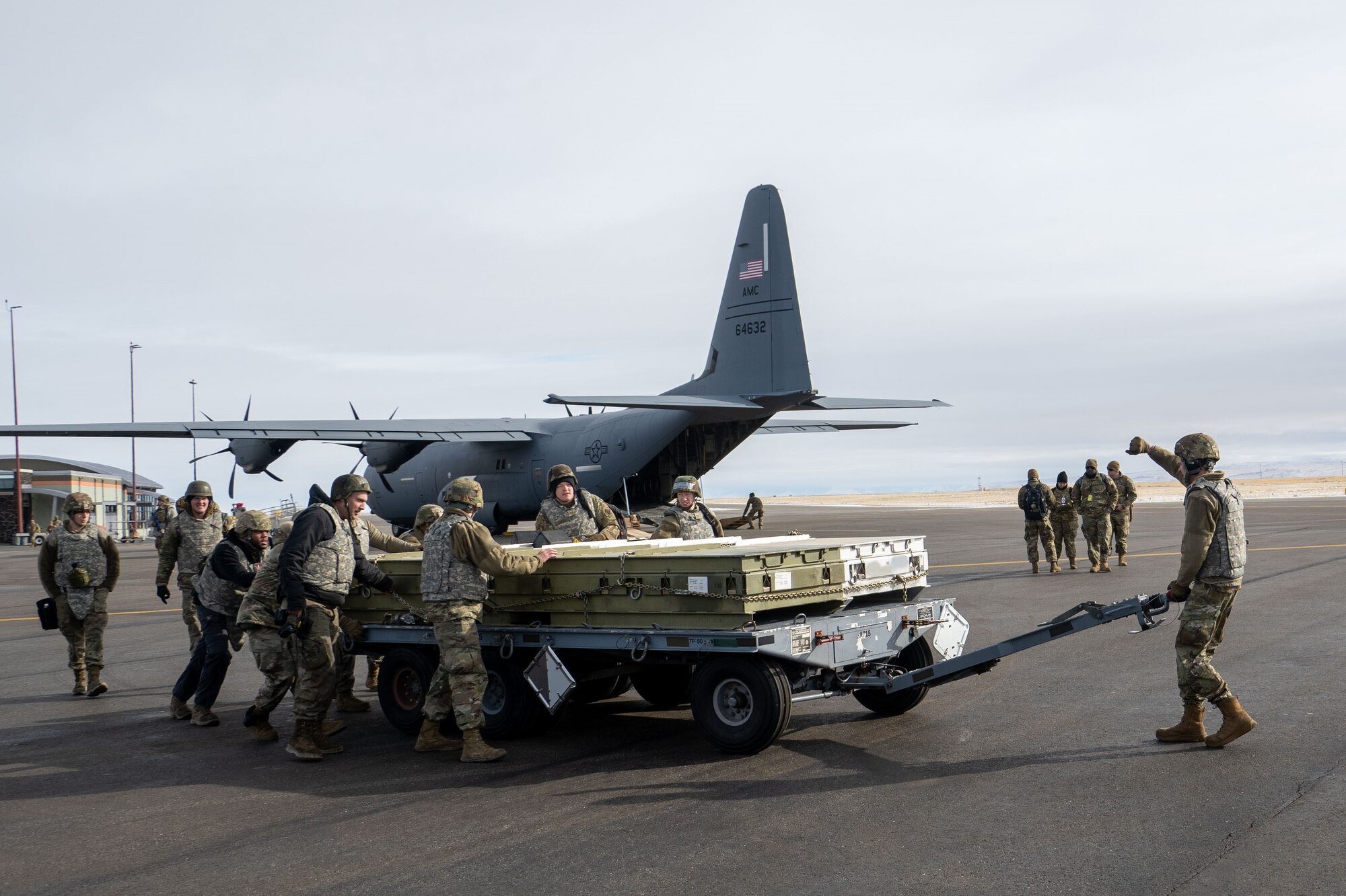 Photo of Airmen unloading cargo