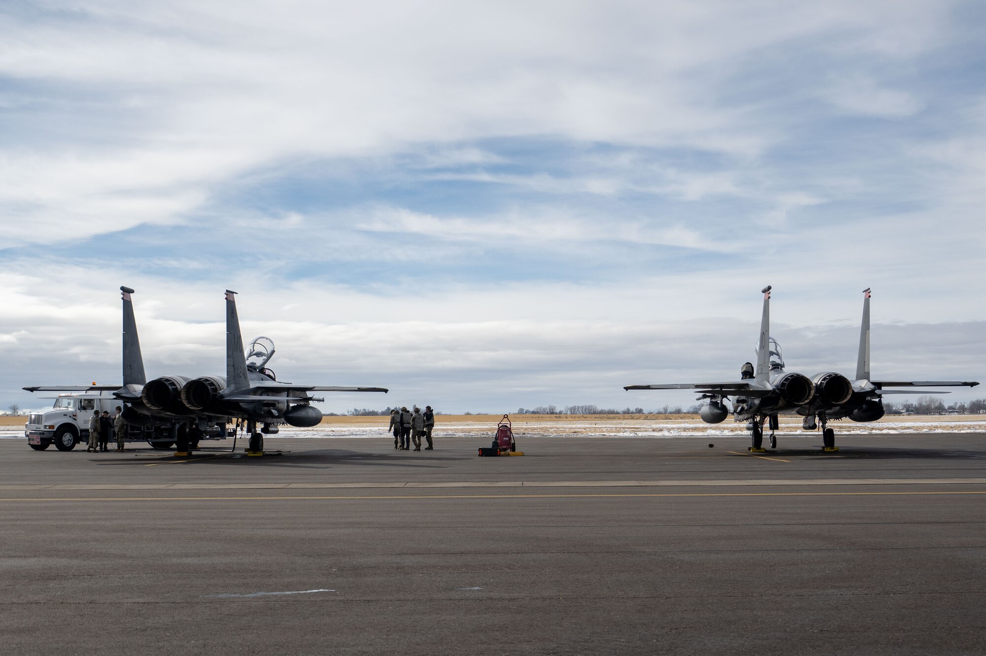 Photo of Airmen inspecting aircraft