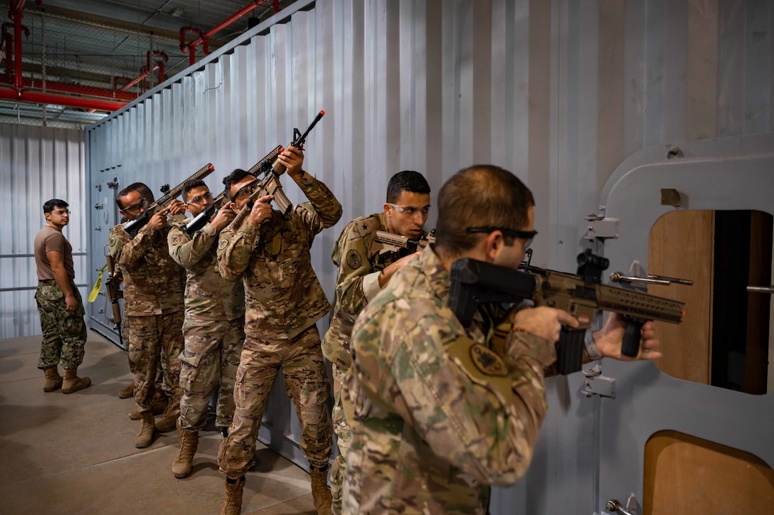 230201-N-EG592-1034 MANAMA, Bahrain (Feb. 1, 2023) Members of the Lebanese Navy rehearse vessel boarding procedures at a U.S. Coast Guard indoor training facility in Manama, Bahrain, Feb. 1.