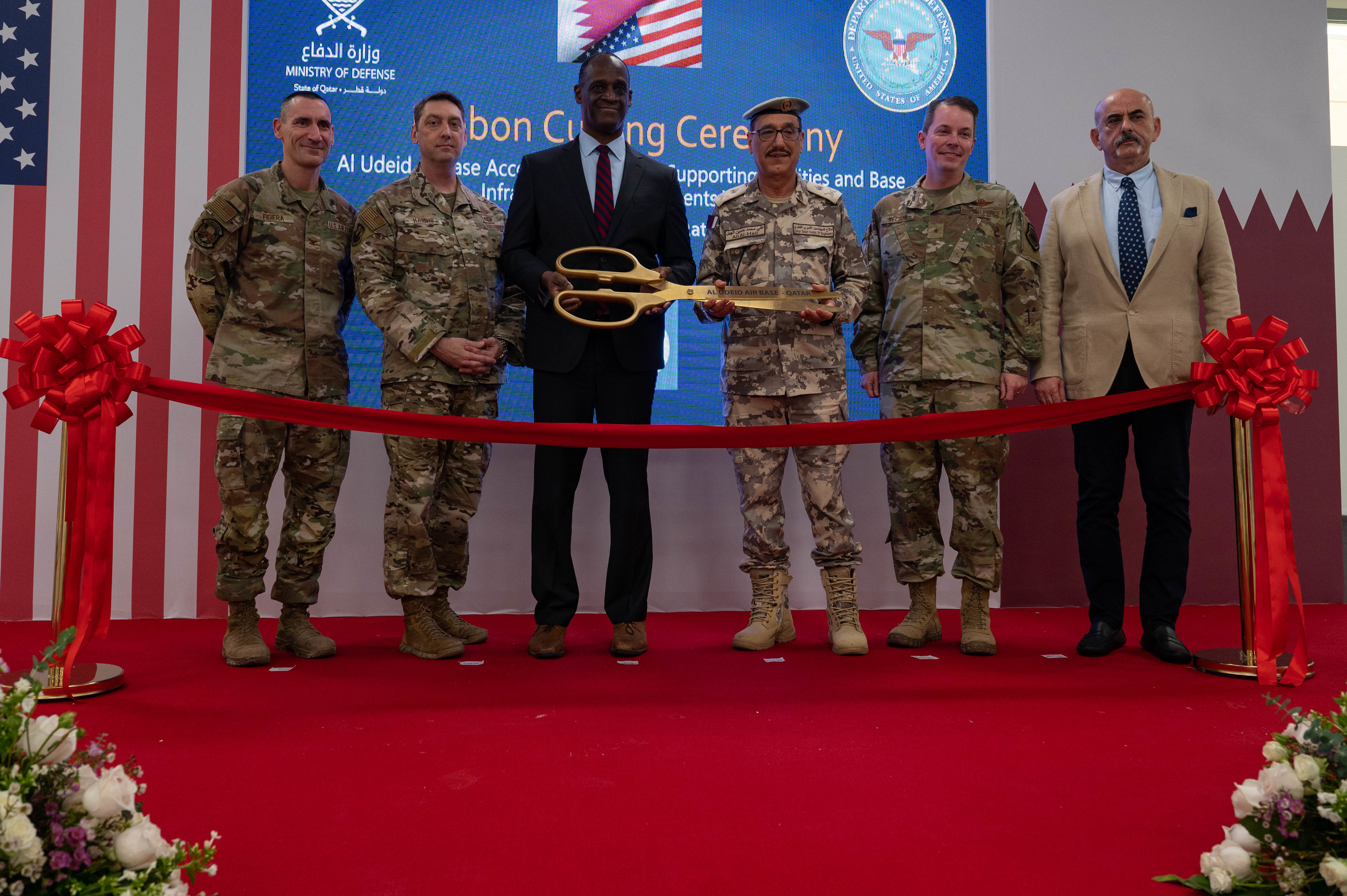 (From left) Col. Anthony Figiera, director of the Air Force Central Command Program Management Office, Maj. Gen. David Harris, Ninth Air Force (Air Forces Central) deputy commander and Combined Forces Air Component Commander, U.S. Central Command, Southwest Asia deputy, Ambassador Timmy Davis, Ambassador of the United States to the State of Qatar, Maj. Gen. Essa Al-Kubasisi, commander of the Qatar Emiri Corps of Engineers, Brig. Gen. Jeffrey Nelson, 379th Air Expeditionary Wing commander, and Mr. Mahmet Gongor, project director for Bahadir Construction pose for a photo during the Qatar Development of Al Udeid Phase 1 ceremony, at Al Udeid Air Base, Qatar, Jan. 26, 2023. Phase 1 of the QDA focused on the construction of 38 new facilities such as new dormitories and dining facilities, enhancing the quality of life for Airmen, Soldiers, Sailors, Marines, Guardians and coalition partners. (U.S. Air Force photo by Staff Sgt. Derek Seifert)