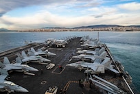 The Nimitz-class aircraft carrier USS George H.W. Bush (CVN 77), along with the embarked staff of Carrier Strike Group (CSG) 10, arrives in Piraeus, Greece, for a scheduled port visit, Feb. 3, 2023.