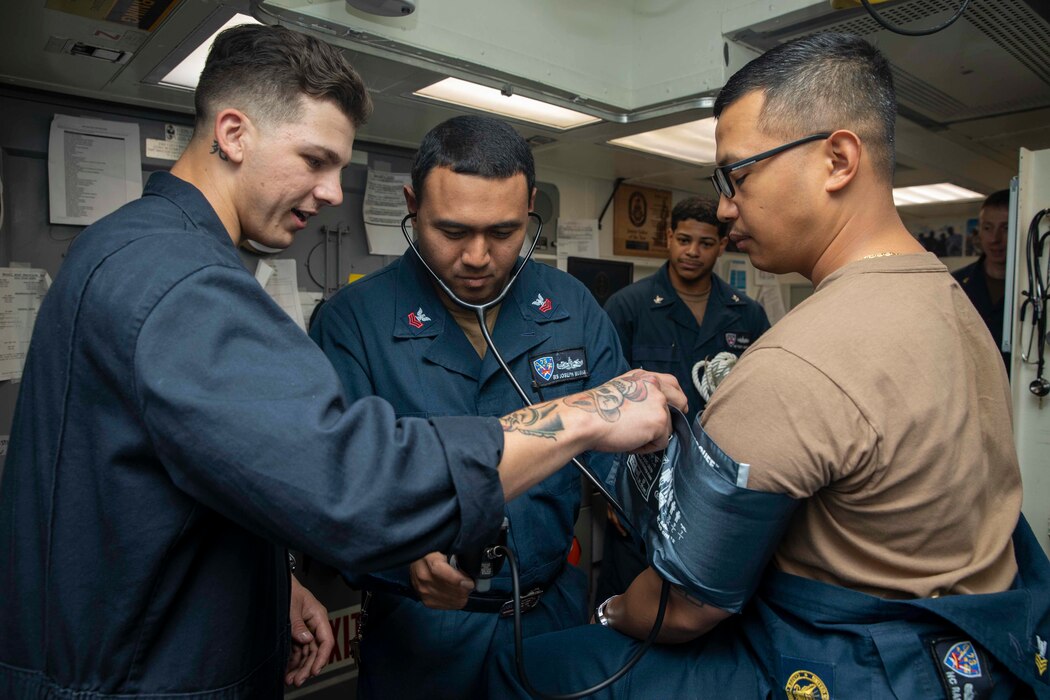 230202-N-SN516-1044 SOUTH CHINA SEA (Feb. 2, 2023) U.S. Navy Hospital Corpsman 3rd Class Steven Grabbitt, left, from Port Huron, Mich., provides medical training to Sailors aboard the Arleigh Burke-class guided-missile destroyer USS Decatur (DDG 73). Decatur, part of the Nimitz Carrier Strike Group, is in U.S. 7th Fleet conducting routine operations. 7th Fleet is the U.S. Navy’s largest forward-deployed numbered fleet, and routinely interacts and operates with Allies and partners in preserving a free and open Indo-Pacific region. (U.S. Navy photo by Mass Communication Specialist 2nd Class David Negron)