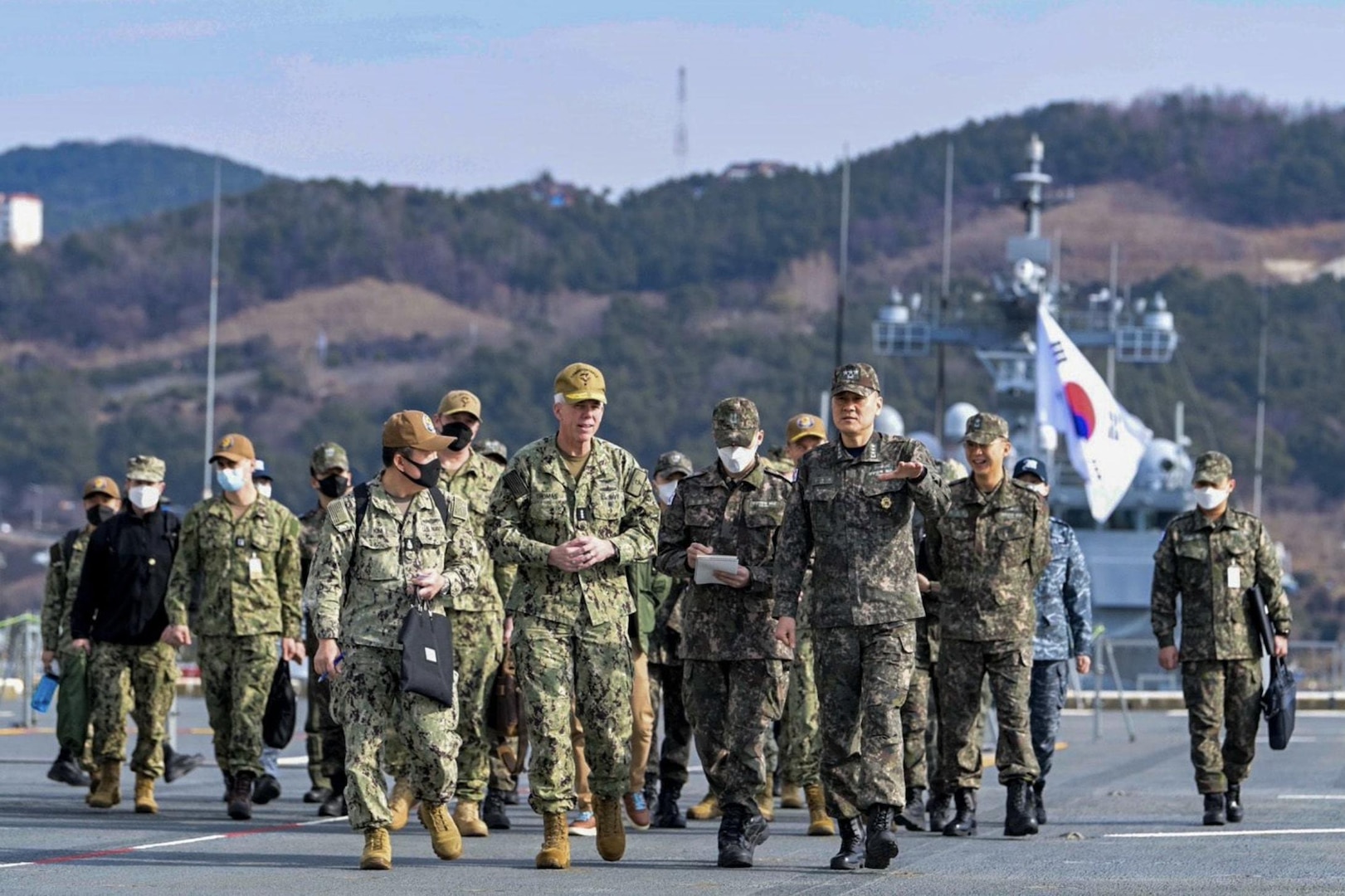 230202-N-SO091-856 BUSAN, Republic of Korea (Feb. 2, 2023) Vice Admiral Kim Jung-soo, Commander Republic of Korea Fleet leads Vice Adm. Karl Thomas, Commander, US 7th Fleet and Staff on a tour of the flight deck aboard the Republic of Korea Navy Dokdo-class Amphibious Assault Ship ROKS Marado (LPH-6112) in Busan, ROK. Vice Adm. Thomas is in the Republic of Korea to attend the 7th annual Anti-submarine Warfare Cooperation Committee meeting. (Courtesy photo by Commander, ROK Fleet Public Affairs)