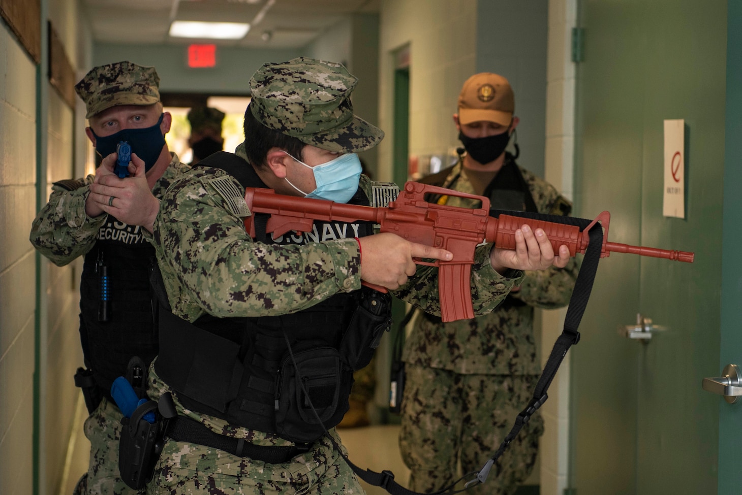 Kings Bay, Ga. (Feb. 4, 2022) Master-at-Arms 3rd Class William Sheffield (left) and Master-at-Arms 2nd Class Freddie Garciasalas (right) sweep a building for threats during an active shooter exercise as part of Citadel Shield-Solid Curtain 2022. CS-SC22 is an important annual exercise designed to ensure Navy security forces are at peak readiness to deter and respond to potential threats. (U.S. Navy photo by Mass Communication Specialist 2nd Class Zachary D. Behrend)