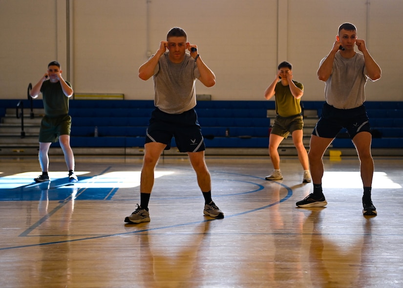 Military members in physical training uniforms.