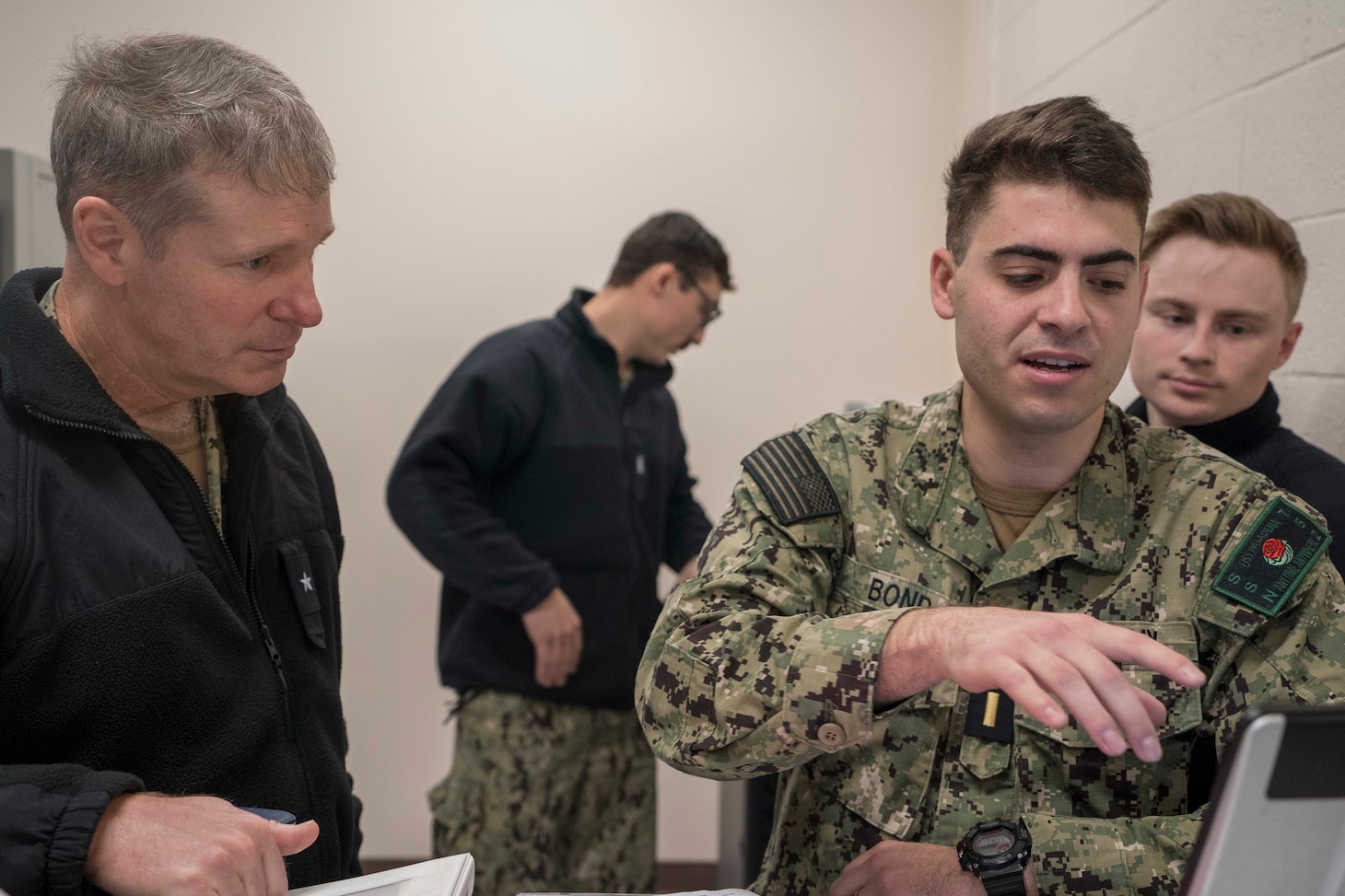 NORFOLK, Va. (Feb. 2, 2023) Rear Adm. Brian Davies, Commander, Sub Group (SUBGRU) 2, speaks with Sailors in the Submarine Multi-mission Team Trainer at the Submarine Learning Facility Norfolk on Naval Station Norfolk, Virginia, Feb. 2. SMMTT is a complex assimilation of training subsystems that simulates submarine combat and ship handling environments. (U.S. Navy photo by Mass Communication Specialist 2nd Class Anderson W. Branch)