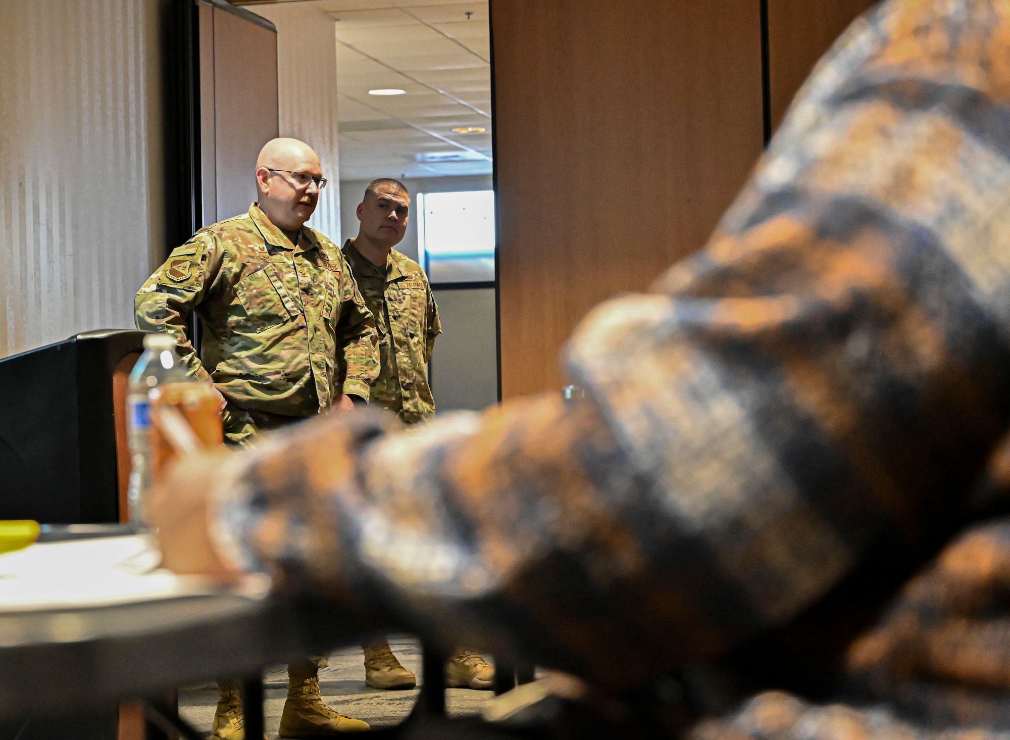 Pictured above is an Airman delivering a speech to a large group.