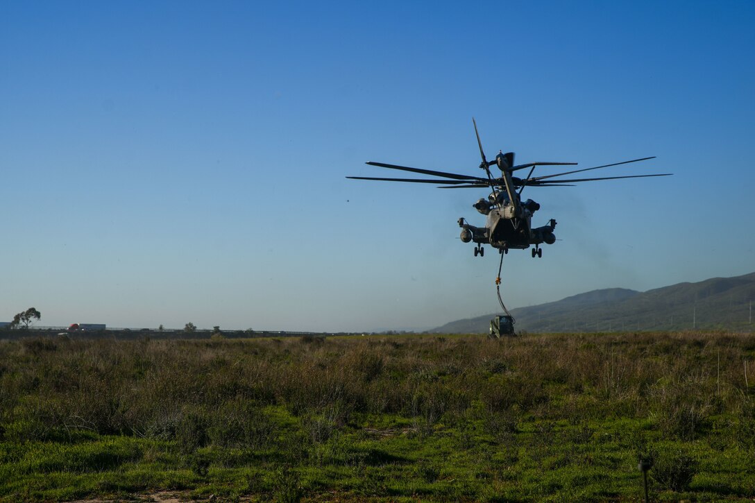 A U.S. Marine Corps CH-53E Super Stallion attached to Marine Heavy Helicopter Squadron (HMH) 361, Marine Aircraft Group 16, 3rd Marine Aircraft Wing, lifts a tractor rubber-tired articulated steering multi-purpose (TRAM) during helicopter support team training as part of Combat Logistics Battalion 15’s Marine Corps Combat Readiness Evaluation (MCCRE) at Marine Corps Base Camp Pendleton,

California, Jan. 25, 2023. The purpose of CLB-15’s MCCRE is to evaluate the unit's ability to perform assigned mission essential tasks in preparation for a future deployment. (U.S. Marine Corps photo by Sgt. Smith)