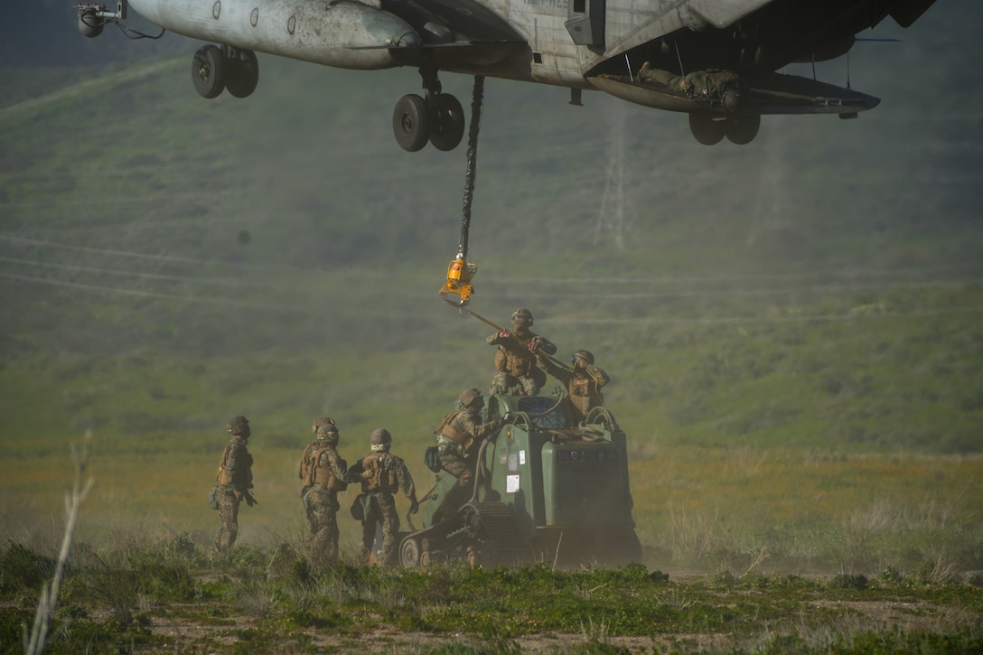 U.S. Marines assigned to Combat Logistics Battalion 15, Combat Logistics Regiment 17, 1st Marine Logistics Group, sling load a tractor rubber-tired articulated steering multi-purpose (TRAM) beneath a CH-53E Super Stallion attached to Marine Heavy Helicopter Squadron (HMH) 361, Marine Aircraft

Group 16, 3rd Marine Aircraft Wing, during helicopter support team training as part of CLB-15’s Marine Corps Combat Readiness Evaluation (MCCRE) at Marine Corps Base Camp Pendleton, California, Jan. 25, 2023. The purpose of CLB-15’s MCCRE is to evaluate the unit's ability to perform assigned mission essential tasks in preparation for a future deployment. (U.S. Marine Corps photo by Sgt. Smith)