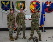 U.S. Air Force Senior Airman Albert Roybal, 5th Aircraft Maintenance Squadron communication navigation mission systems maintainer, receives the first-ever Airman Against Drunk Driving (AADD) Volunteer of the Month Award at Minot Air Force Base, North Dakota, Feb. 2, 2023. Roybal had volunteered 145 hours with AADD over the course of four months. (U.S. Air Force photo by Senior Airman Evan Lichtenhan)