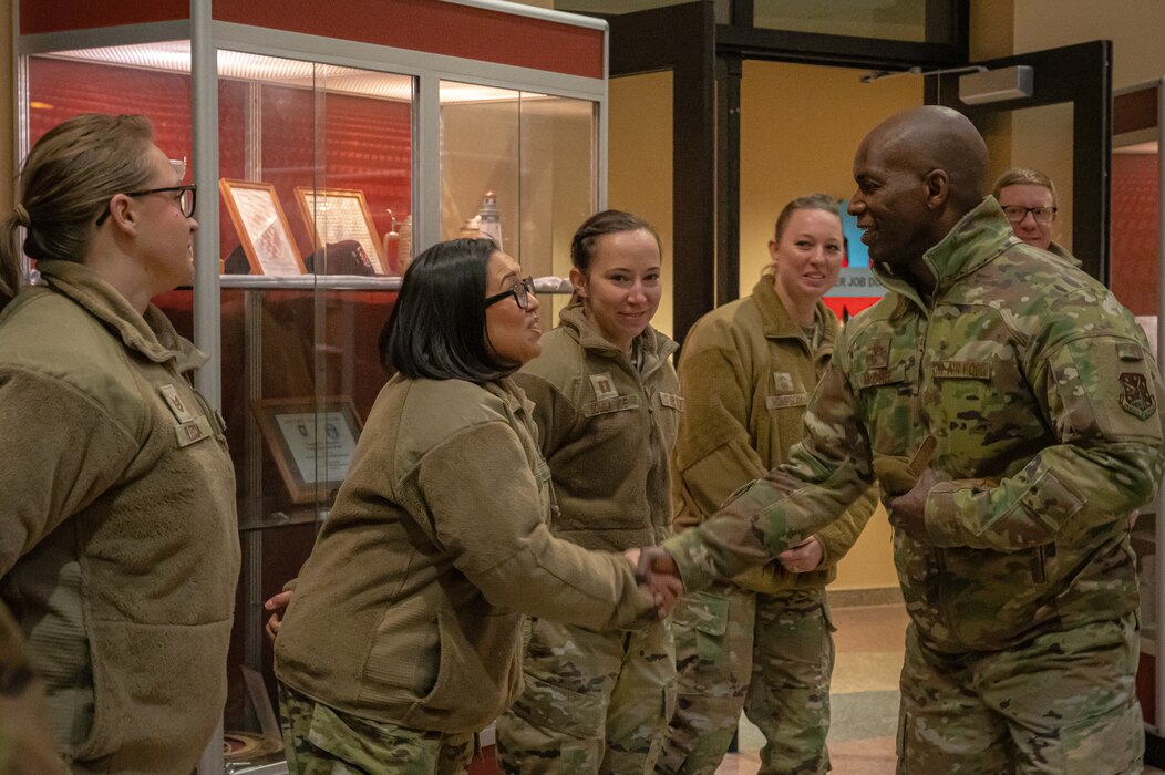 U.S. Air Force Col. Kenneth C. McGhee, 91st Missile Wing commander, greets 5th Force Support Squadron Airmen at Minot Air Force Base, North Dakota, Jan. 30, 2023. Airmen assigned to the services career field maintain and operate hotels, restaurants and fitness centers through the Air Force. (U.S. Air Force photo by Airman 1st Class Alexander Nottingham)